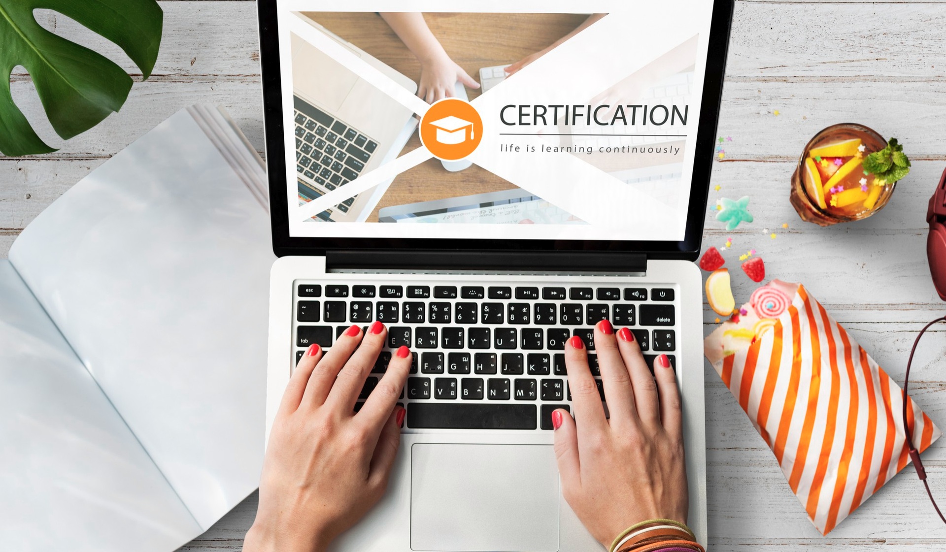 A laptop displaying an online certification course