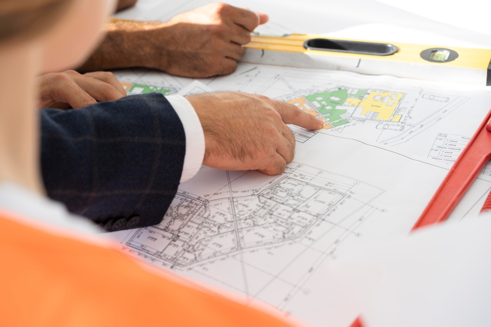 Colleagues reviewing architectural plans