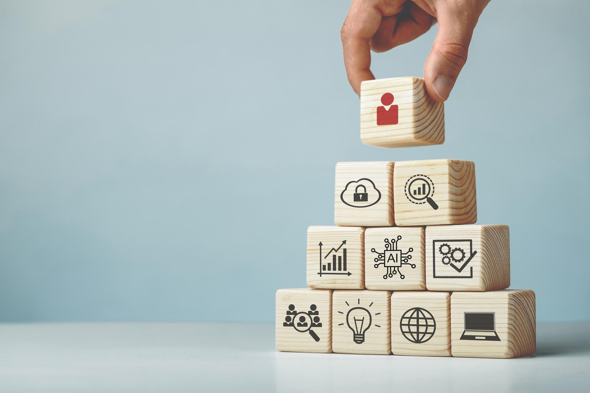 Wooden blocks displaying research, learning and digital resource symbols