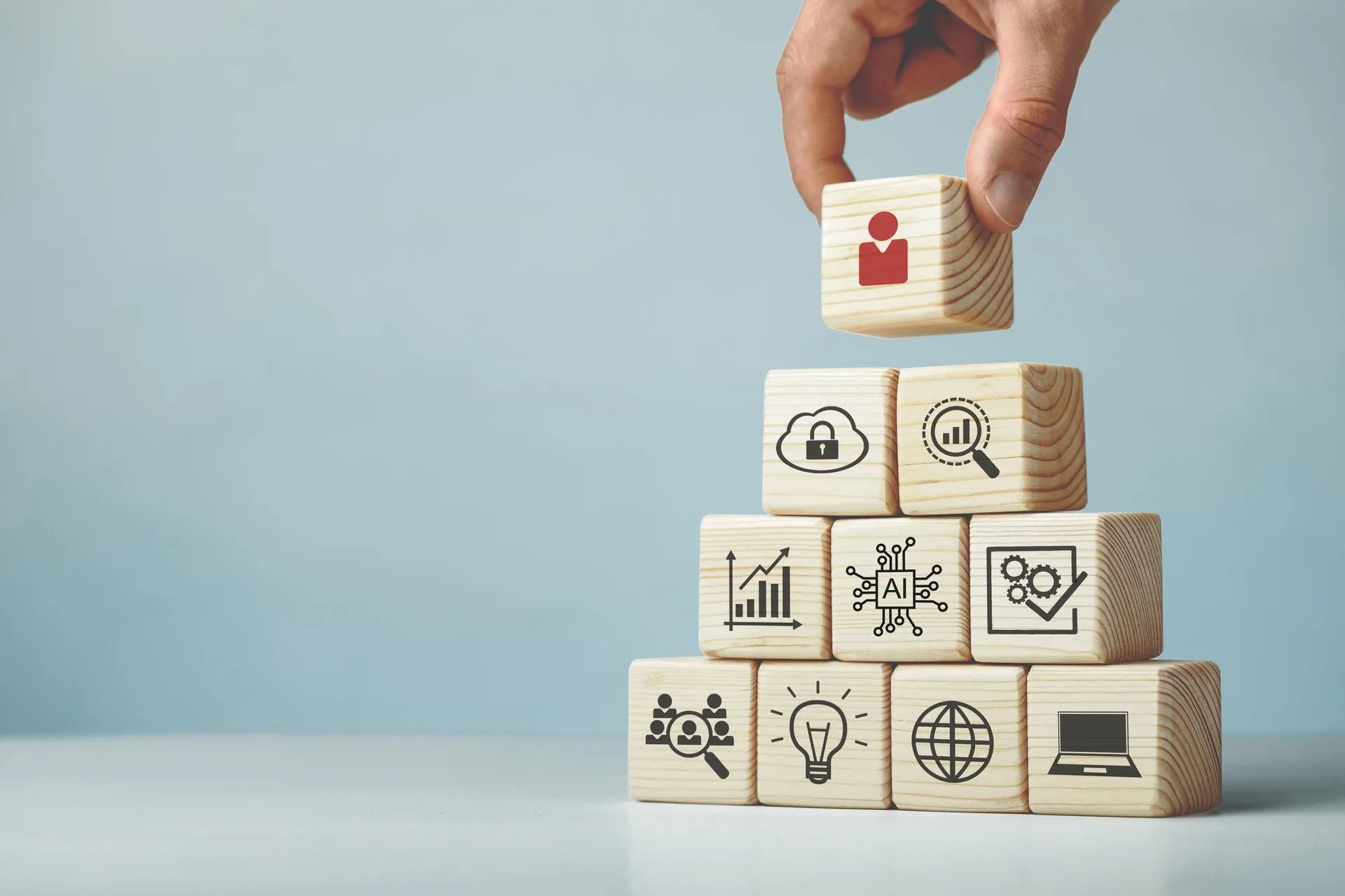 Wooden blocks displaying research, learning and digital resource symbols