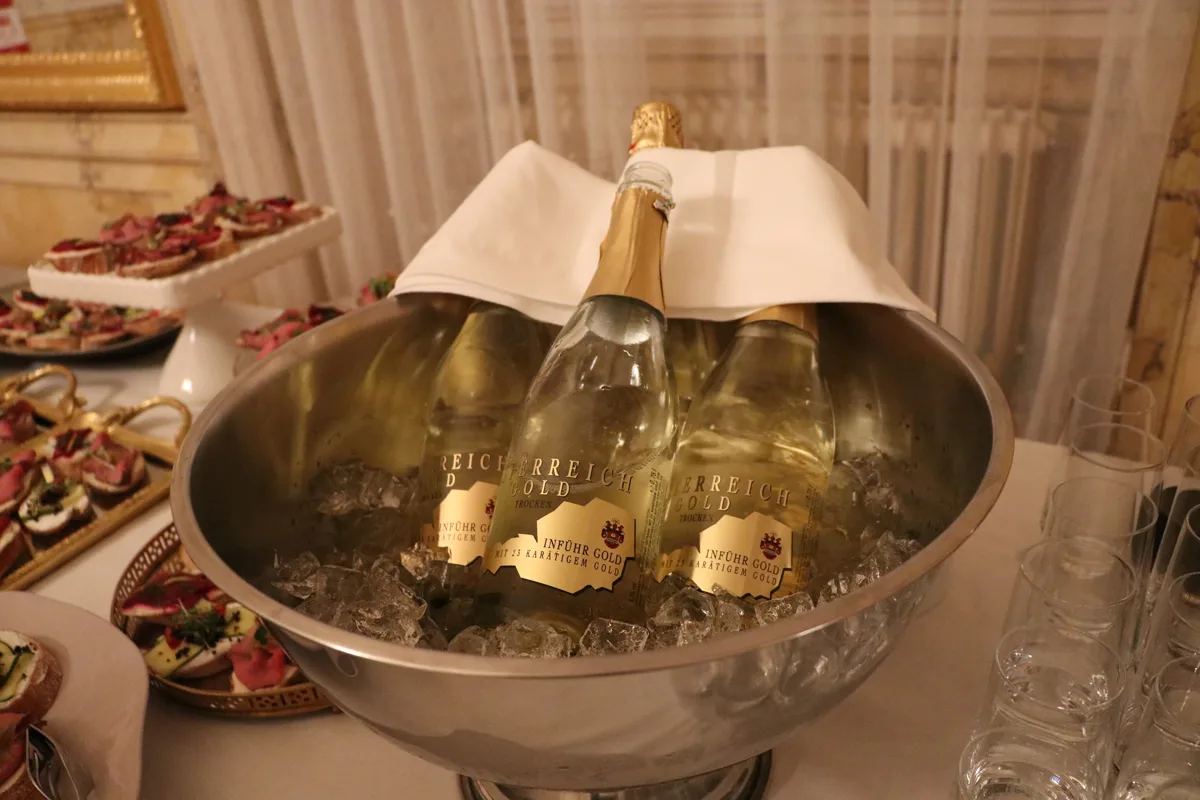 Chilled wine bottles and refreshments at a conference reception