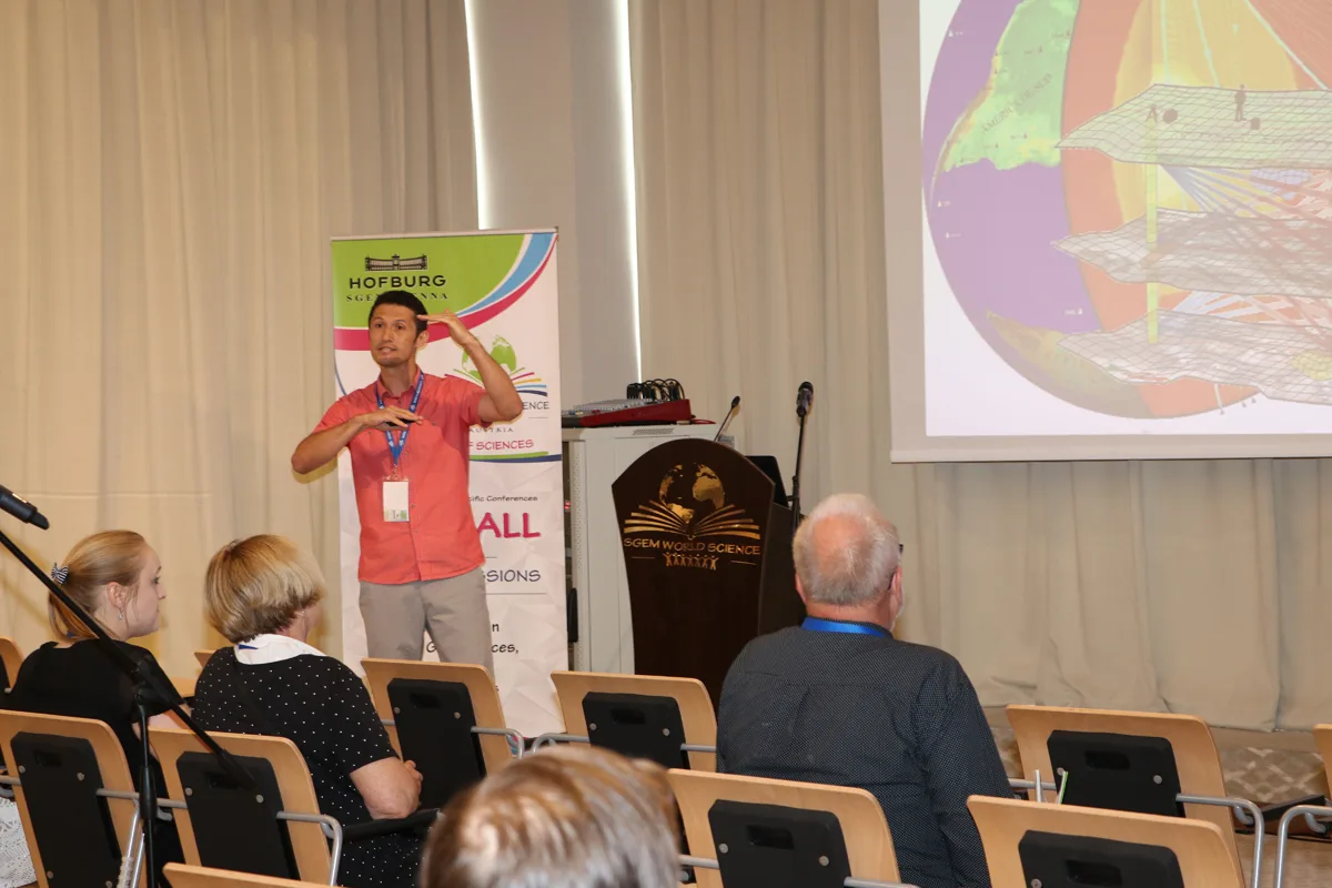 A speaker presenting research to an SGEM audience