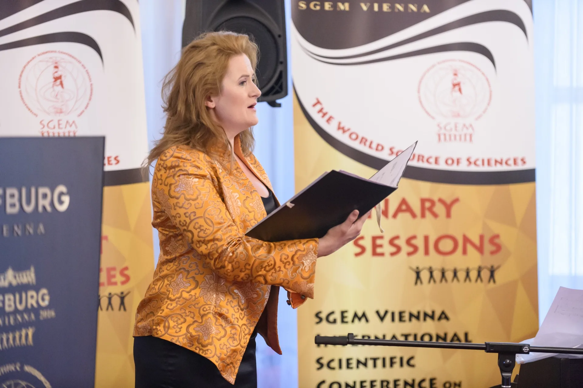 A vocalist performing from a score at SGEM Vienna