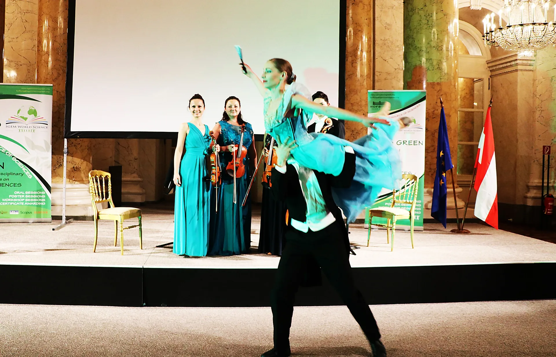 A dance performance before a string ensemble at an SGEM event