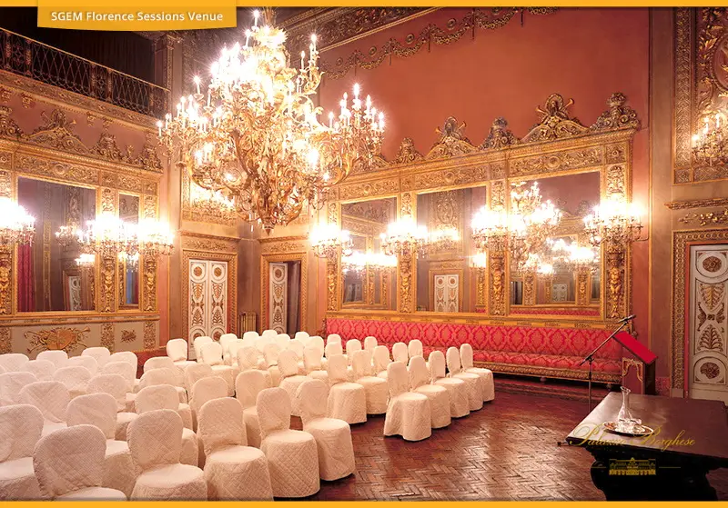 Rows of white conference chairs in a gilded hall at Palazzo Borghese