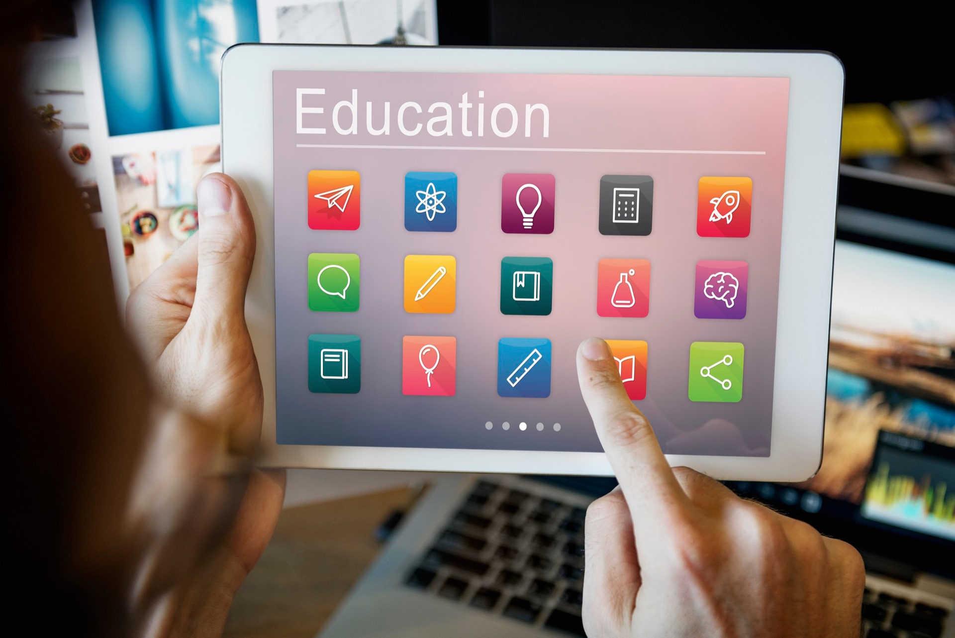 A tablet displaying educational tools and subject icons
