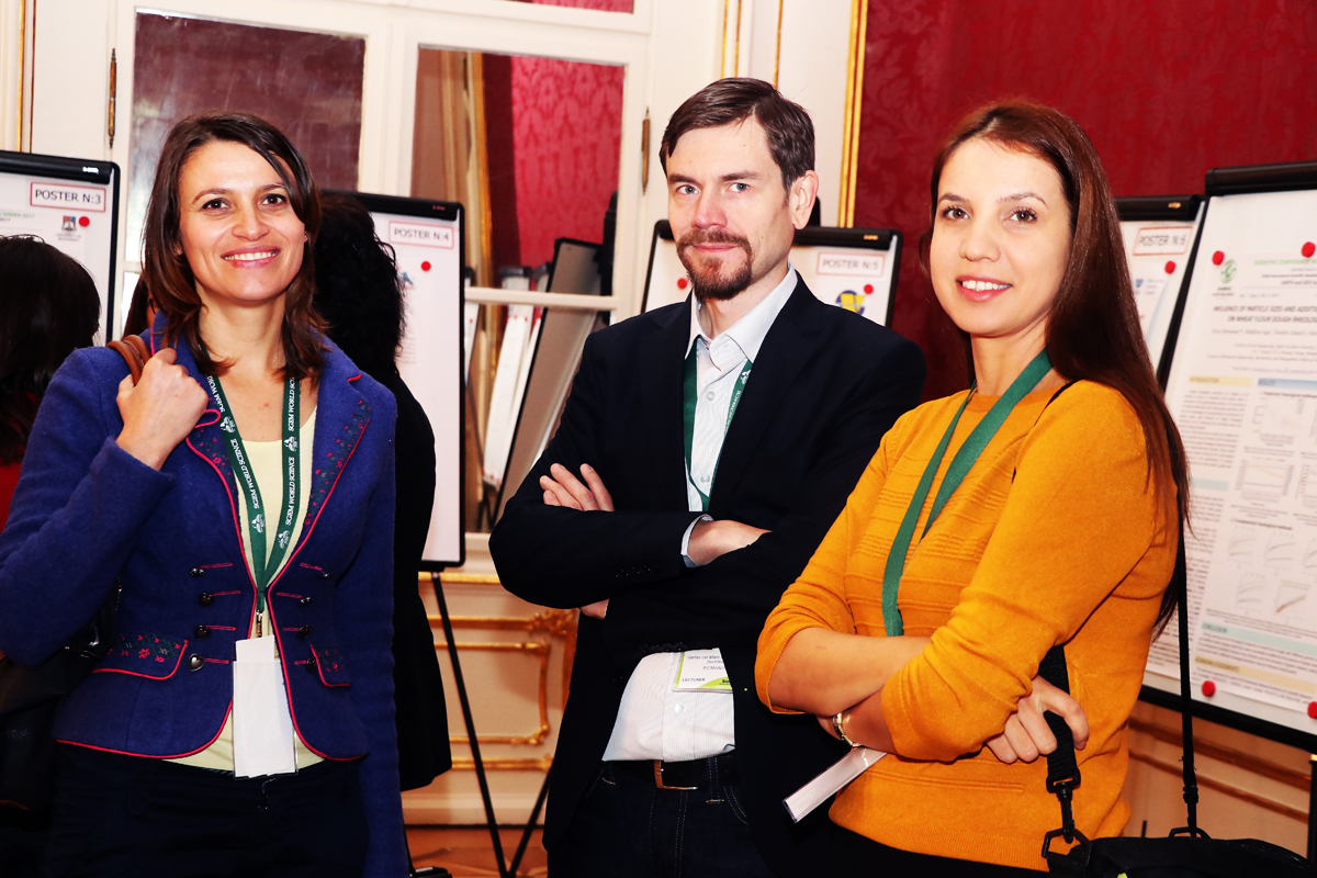 Three SGEM delegates standing beside scientific posters