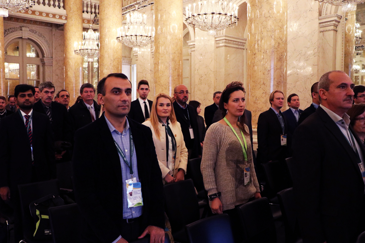 SGEM delegates standing during a conference ceremony