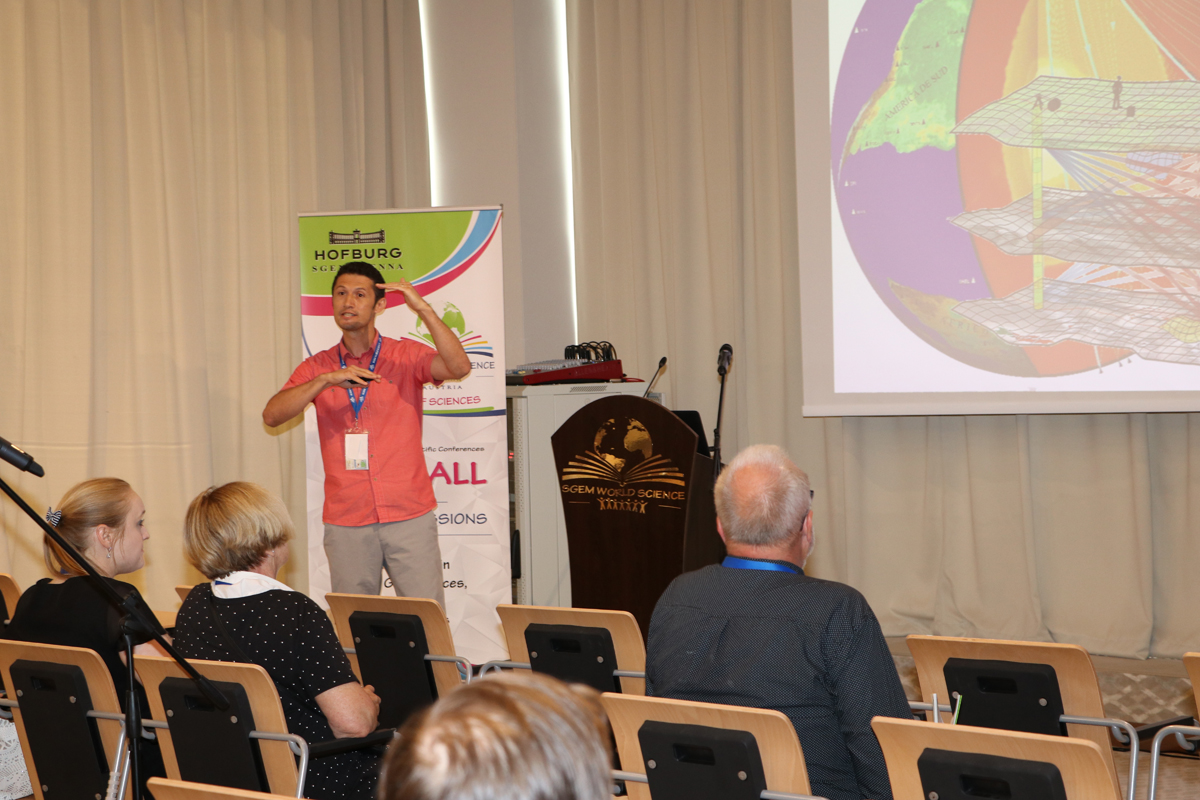 A speaker presenting research to an SGEM audience