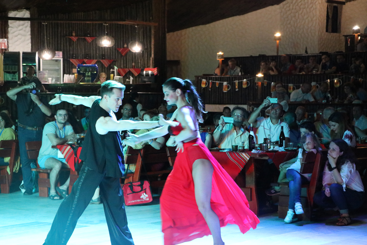 Dancers performing for guests at an evening conference event