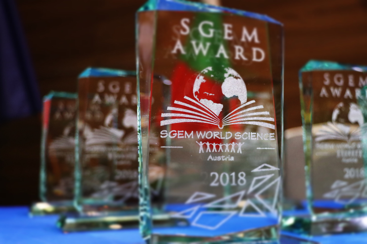 Close-up of glass SGEM World Science awards dated 2018