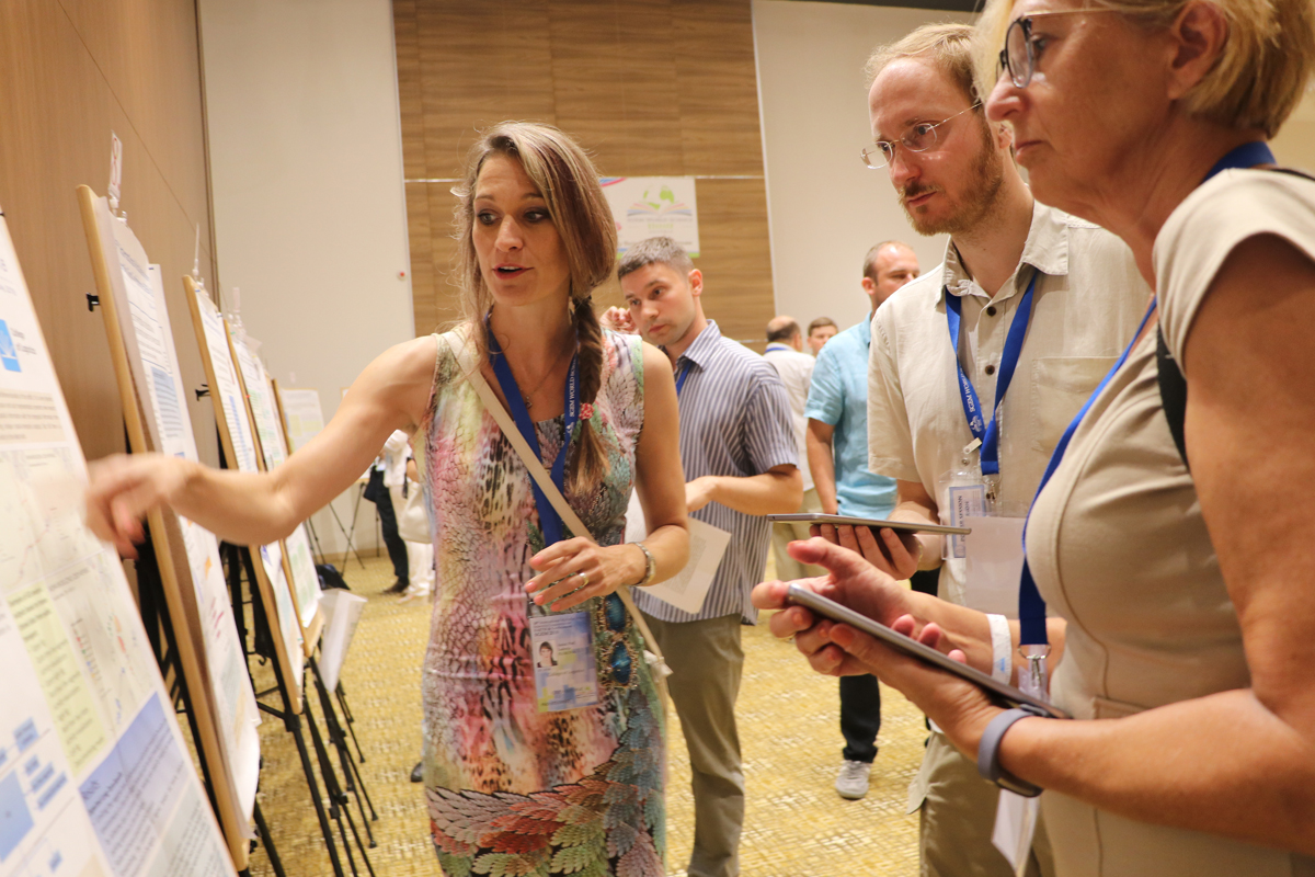 Researchers examining a scientific poster together