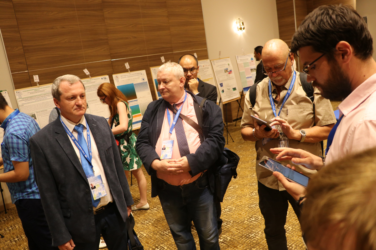 Participants exchanging ideas during a scientific poster session