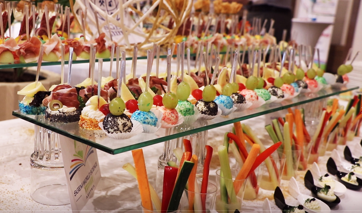 Small desserts, fruit and vegetable cups arranged on a conference buffet