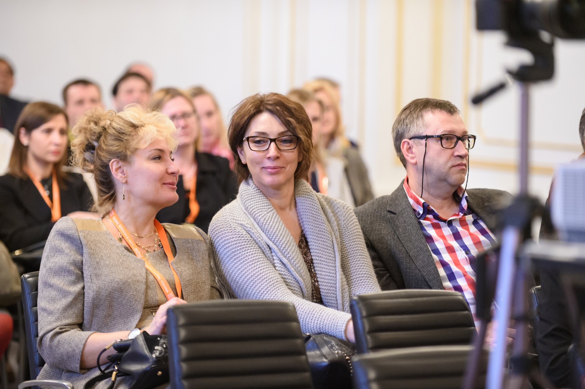 Three delegates seated together at an SGEM Vienna session