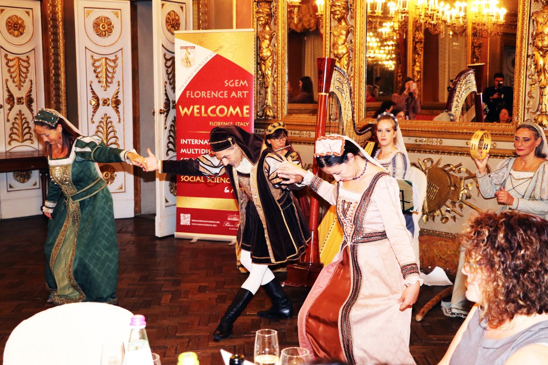 Costumed dancers performing at an SGEM Florence Art event