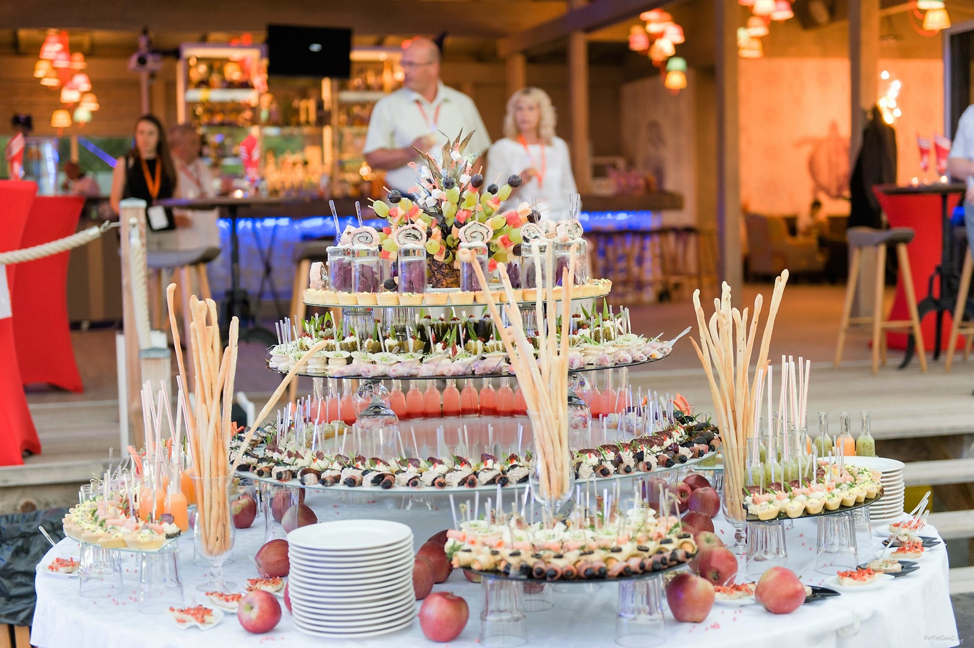 A tiered buffet of small desserts at a conference celebration