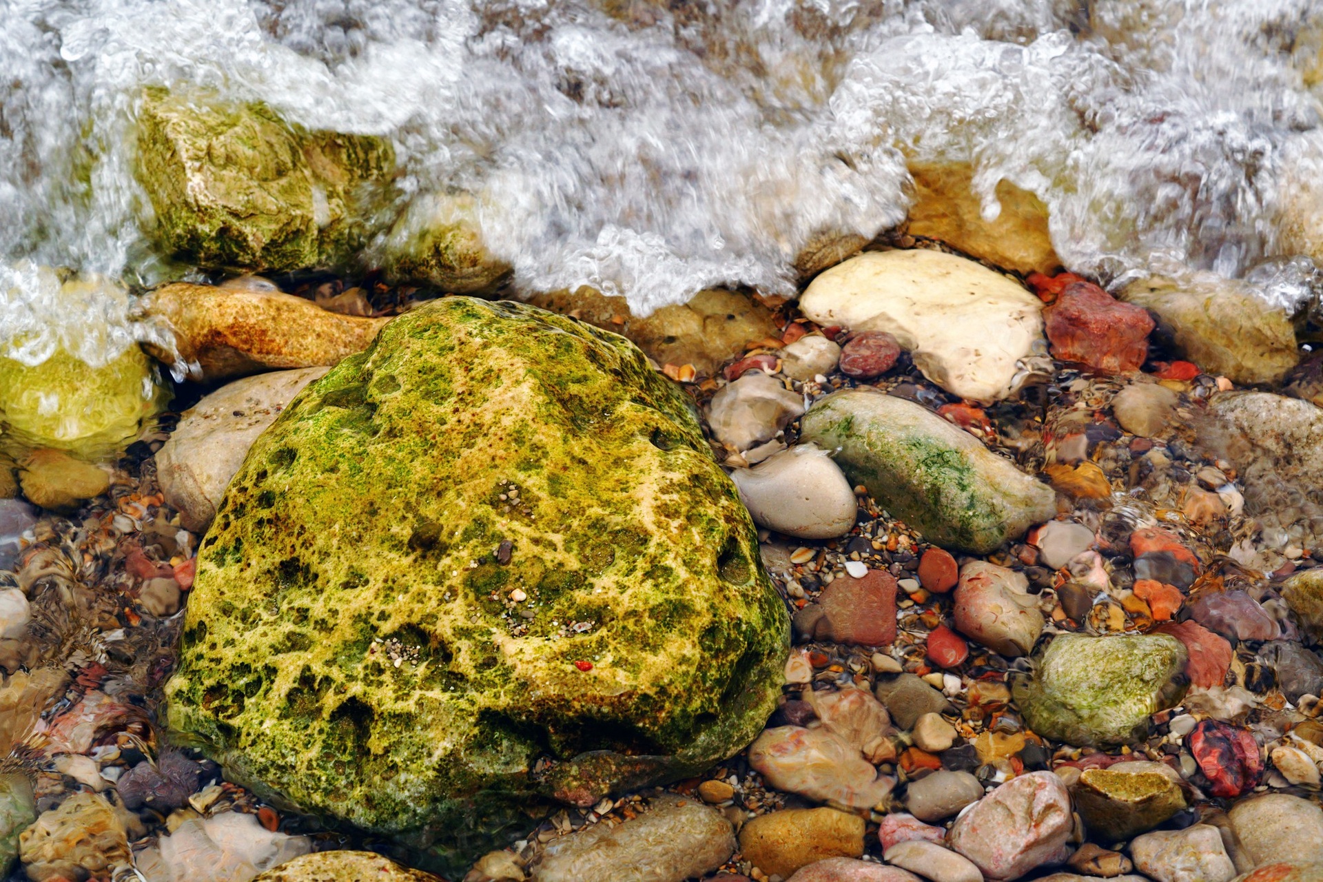 Water flowing over moss-covered stones