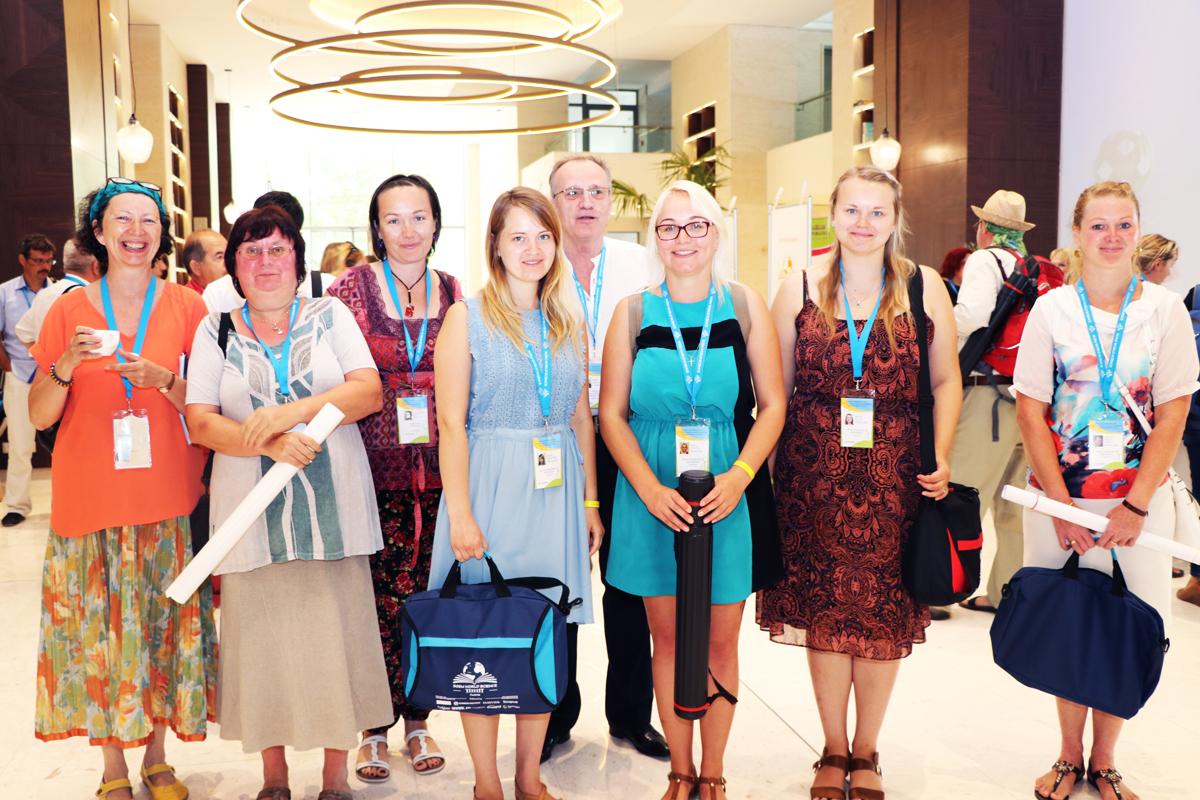 A group of delegates posing with conference certificates