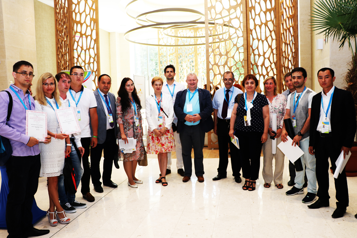 SGEM participants posing together in a conference foyer