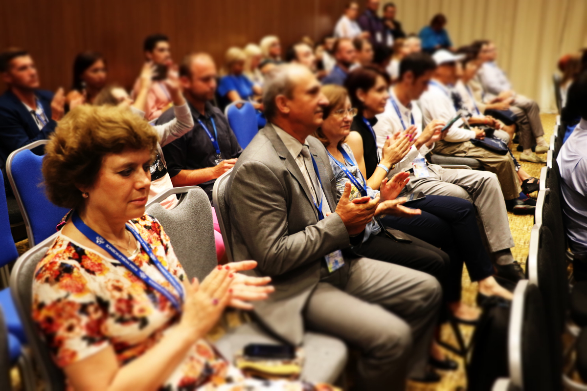 SGEM delegates applauding from auditorium seats