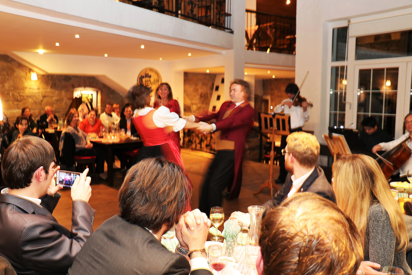 Dancers entertaining guests during a conference dinner
